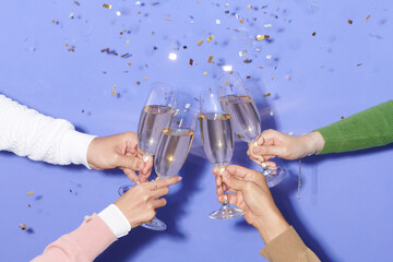 Dinner party with drinking of champagne. hands holding clear glass