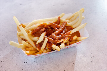 A view of a tray of chili fries.
