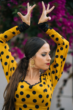 Talented young lady performing flamenco dance on street