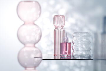 Cosmetic liquid mockup in transparent bottle, glass vase decor. 