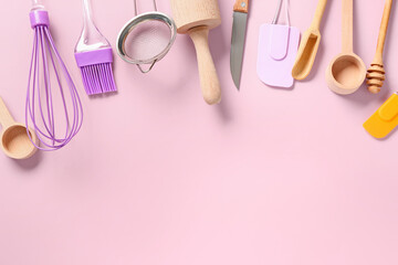 Baking utensils on pink background