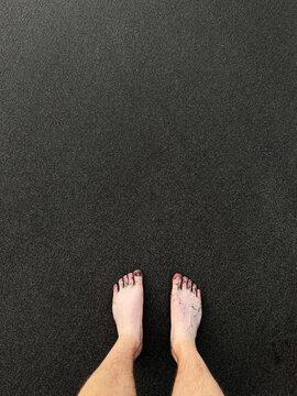 POV View Of Feet At Black Sand Beach In Tenerife