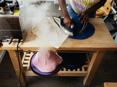 Craft felt hat making, ironing with a steamer