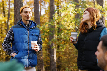 Friends enjoying drink camp fall season