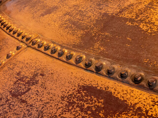 Metal background, old copper wall with rivets