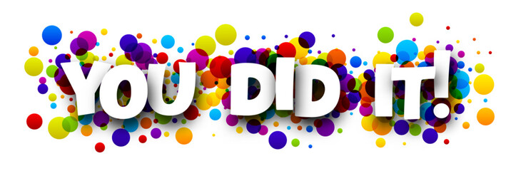 You did it sign over colorful round dots background.