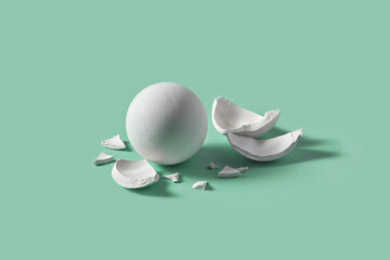 Broken pieces around whole marble sphere.