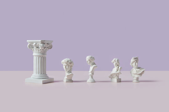 White Roman column with four small marble Greek statues.