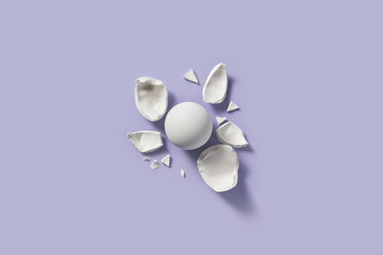 White plaster sphere and broken fragments scattered around.