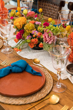 A table set up for a wedding with colorful flowers
