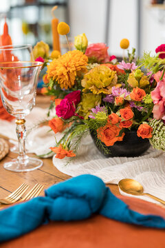 A colorful floral arrangement on a wedding table