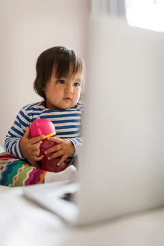baby girl looking at computer