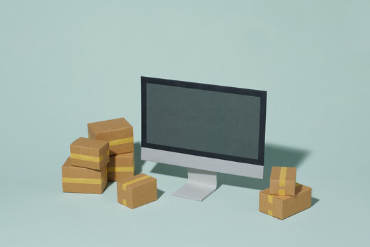 Stack of cardboard boxes with pc computer