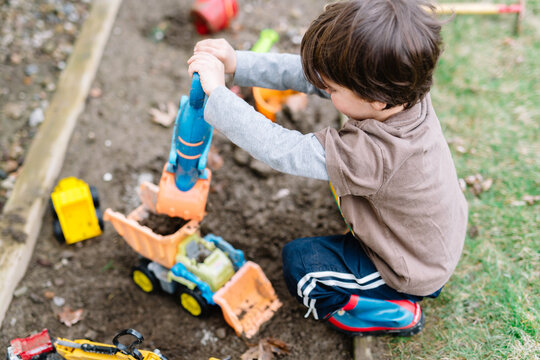 Boy plays in dirt