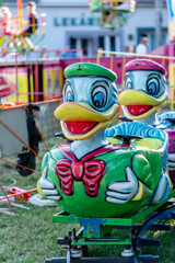 carousel with smiling ducks. Children's attraction carousel, summer vacation