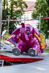 carousel with pink elephant, Children's attraction carousel, summer vacation