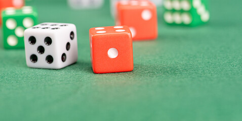Dice, beautiful dice placed on green felt surface, selective focus.