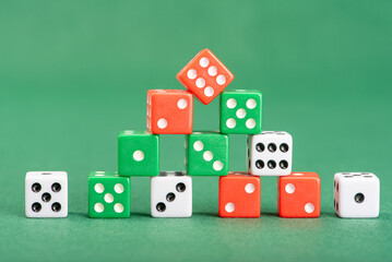 Dice, beautiful dice placed on green felt surface, selective focus.