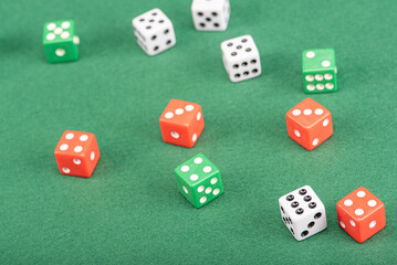 Dice, beautiful dice placed on green felt surface, selective focus.