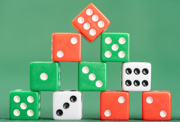 Dice, beautiful dice placed on green felt surface, selective focus.