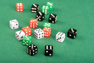 Dice, beautiful dice placed on green felt surface, selective focus.