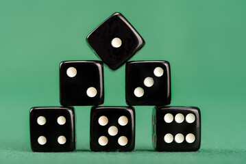 Dice, beautiful dice placed on green felt surface, selective focus.