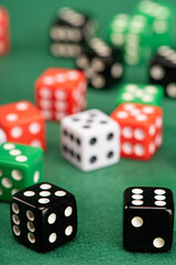 Dice, beautiful dice placed on green felt surface, selective focus.