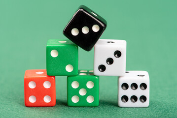 Dice, beautiful dice placed on green felt surface, selective focus.