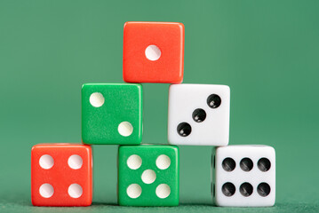Dice, beautiful dice placed on green felt surface, selective focus.