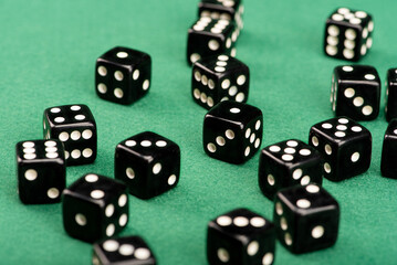 Dice, beautiful dice placed on green felt surface, selective focus.