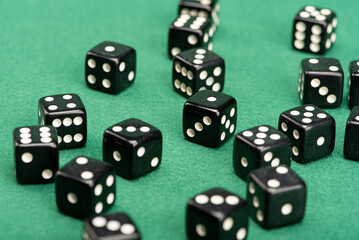 Dice, beautiful dice placed on green felt surface, selective focus.