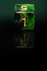 RPG dice, beautiful RPG dice placed on reflective surface and dark background, selective focus.