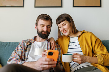 Lovers gadget drink phone quality time home smile