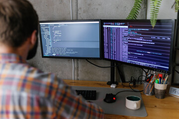 Code lines. Focused on work. Programming. Gadget. Modern technology