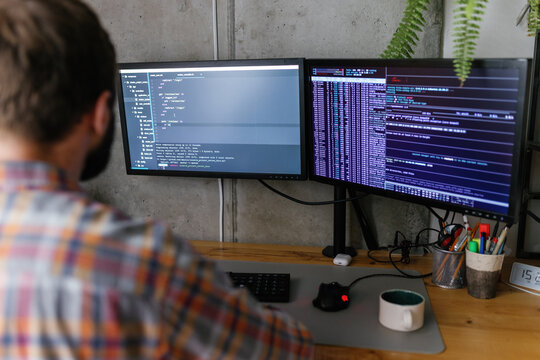 Code lines. Focused on work. Programming. Gadget. Modern technology