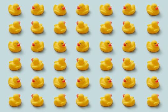 Creative pattern of rows of yellow rubber ducks.