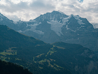 Jungfrau Mountainpeak alps 4500m cloudy day huge Glaciers Lauterbrunnen village in swiss Alps