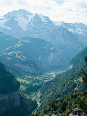Fototapeta na wymiar Jungfrau Mountainpeak alps 4500m cloudy day huge Glaciers Lauterbrunnen village in swiss Alps