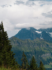 Close view at the Eiger North face with clouds on the Mountain Peak