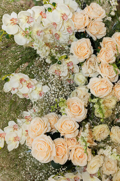 Closeup of a rose and orchid floral ornament with flashlight