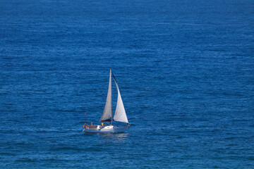 Cabin Sailing Boat On Open Blue Ocean