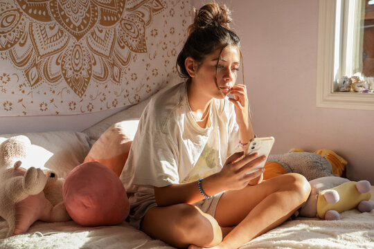 Teenage Girl on Phone - Powered by Adobe