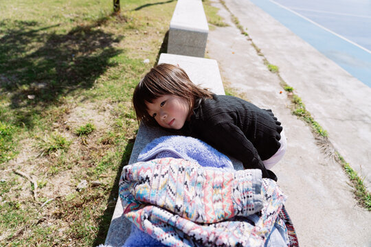 little girl rest  on the court