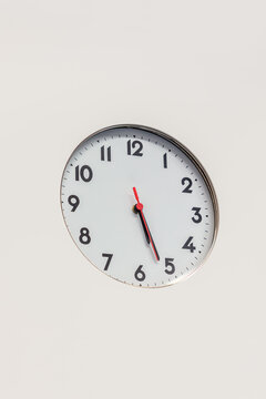 Simple round cock on white wall