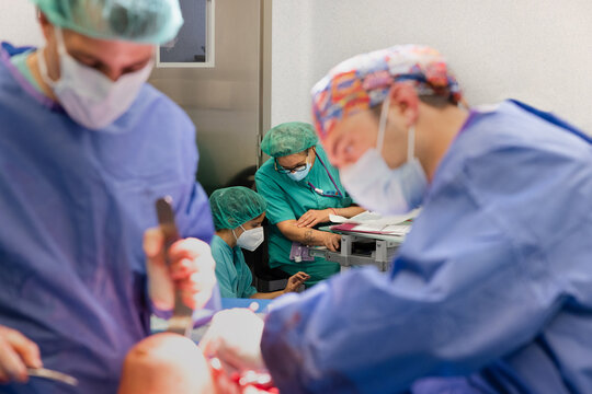 Nurses in operating room with working doctors