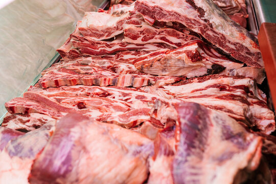 Cut raw beef in container