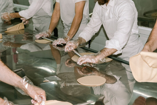 Traditional Matzah Making.Preparing Matza Shmura,Rolling Out Dough.