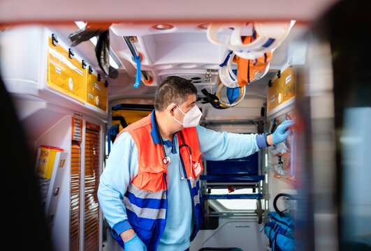 paramedic nurse working on an ambulance - Powered by Adobe