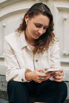 Woman listening to music from her phone