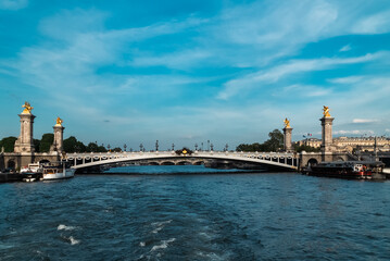 Paris, France. April 22, 2022: Famous Alexander III Bridge with beautiful blue sky.